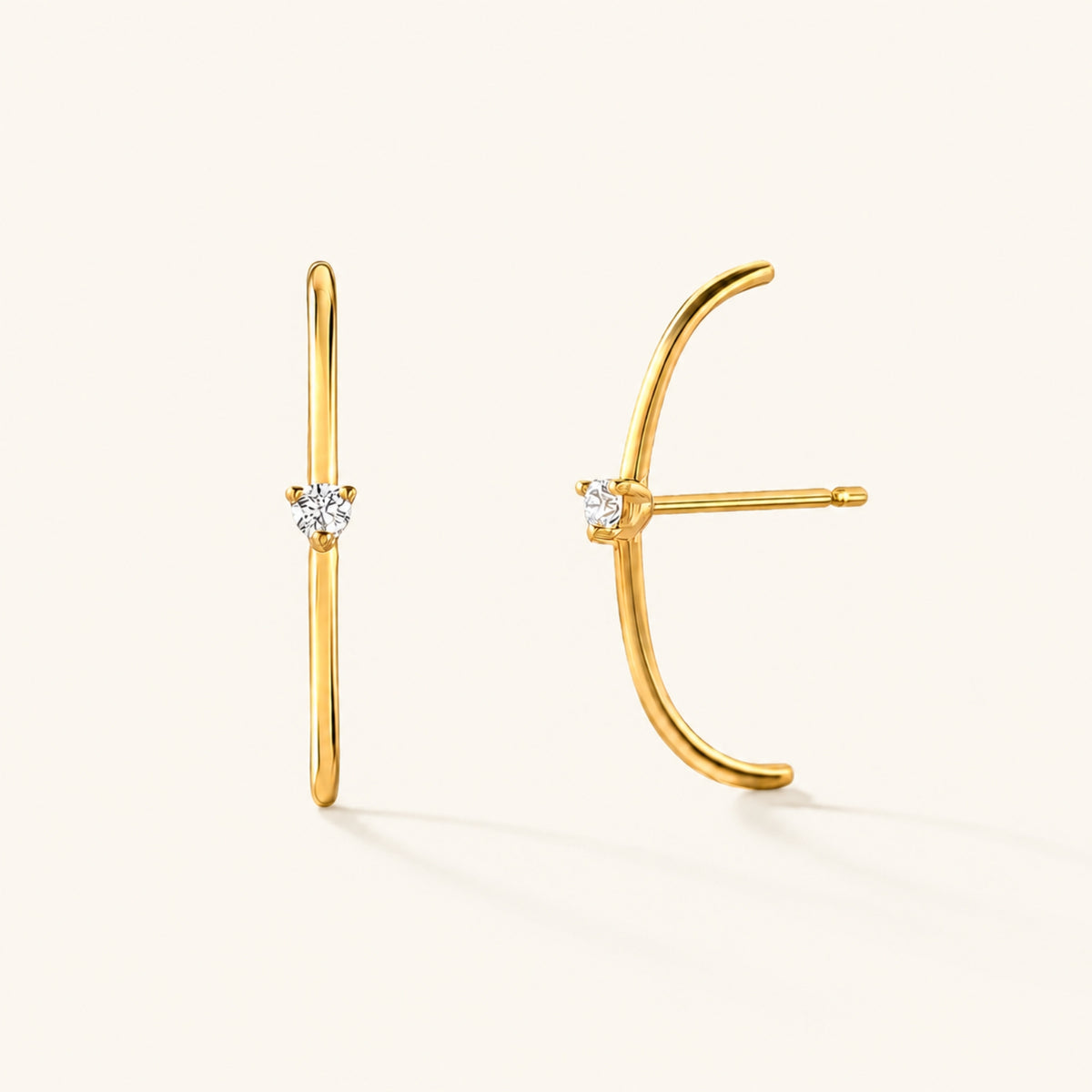 Les boucles d'oreilles Arc diamanté