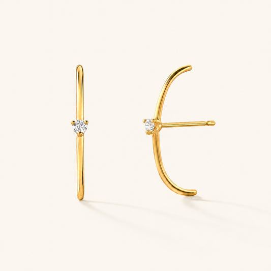 Les boucles d'oreilles Arc diamanté