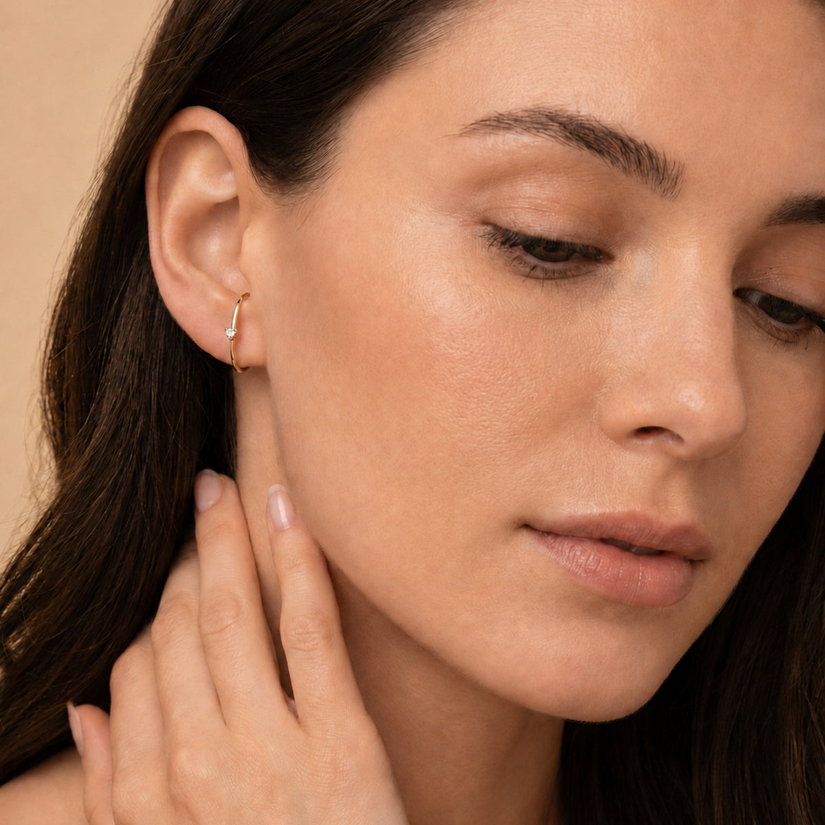 Les boucles d'oreilles Arc diamanté