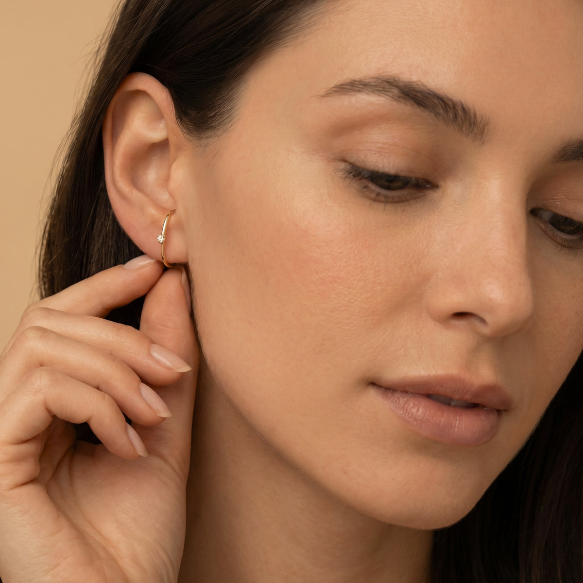 Les boucles d'oreilles Arc diamanté