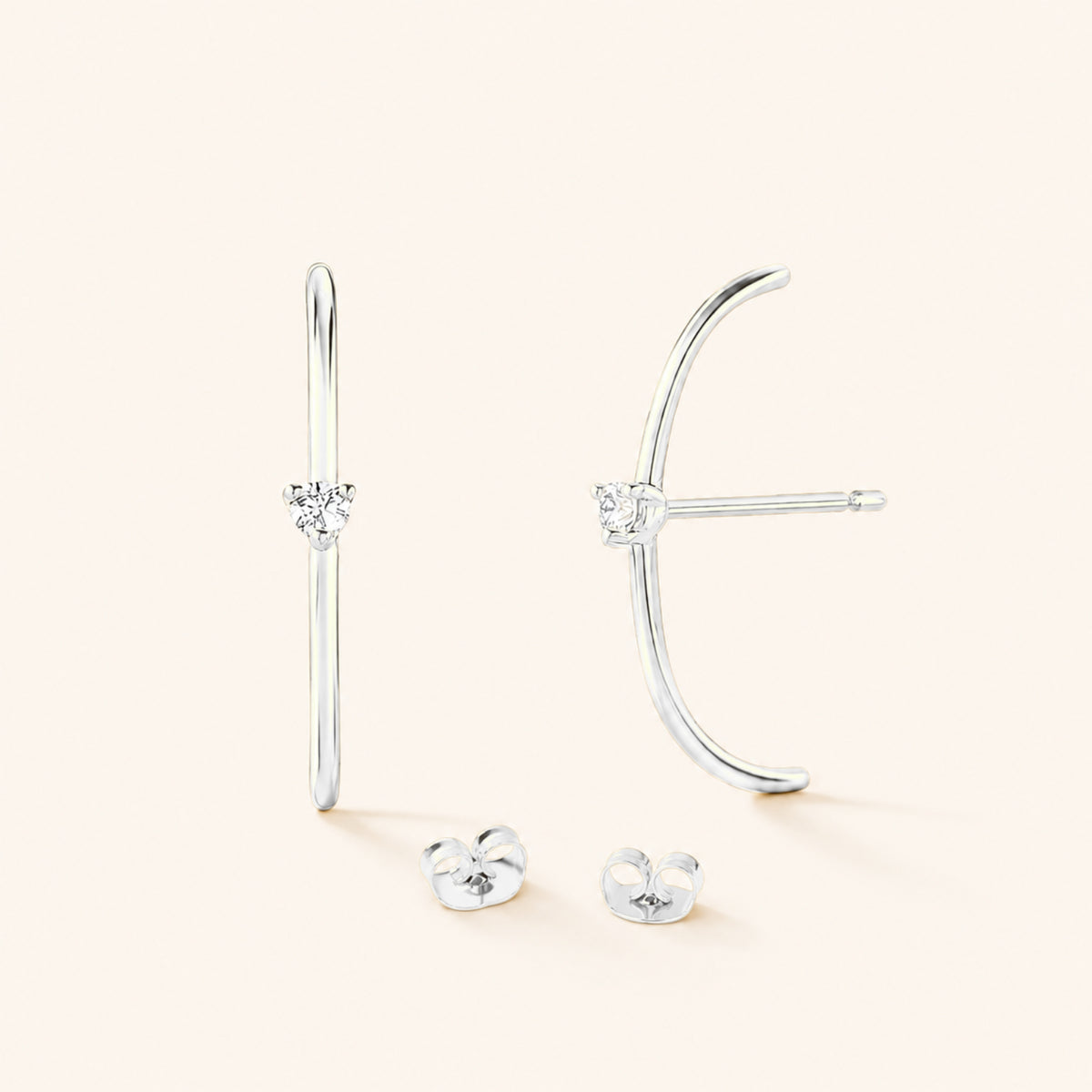 Les boucles d'oreilles Arc diamanté