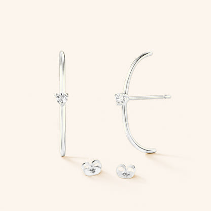 Les boucles d'oreilles Arc diamanté